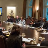 Photo: (Official White House Photo by Pete Souza) President Barack Obama convenes a meeting with cabinet agencies coordinating the government's Ebola response, in the Cabinet Room of the White House, Oct.15, 2014.