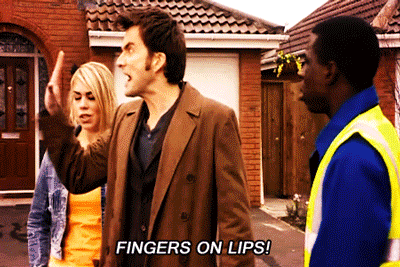 image of man saying Fingers on lips