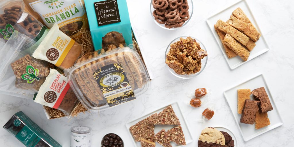 a photo of the various sweet and savory treats in a Packed With Purpose gift box