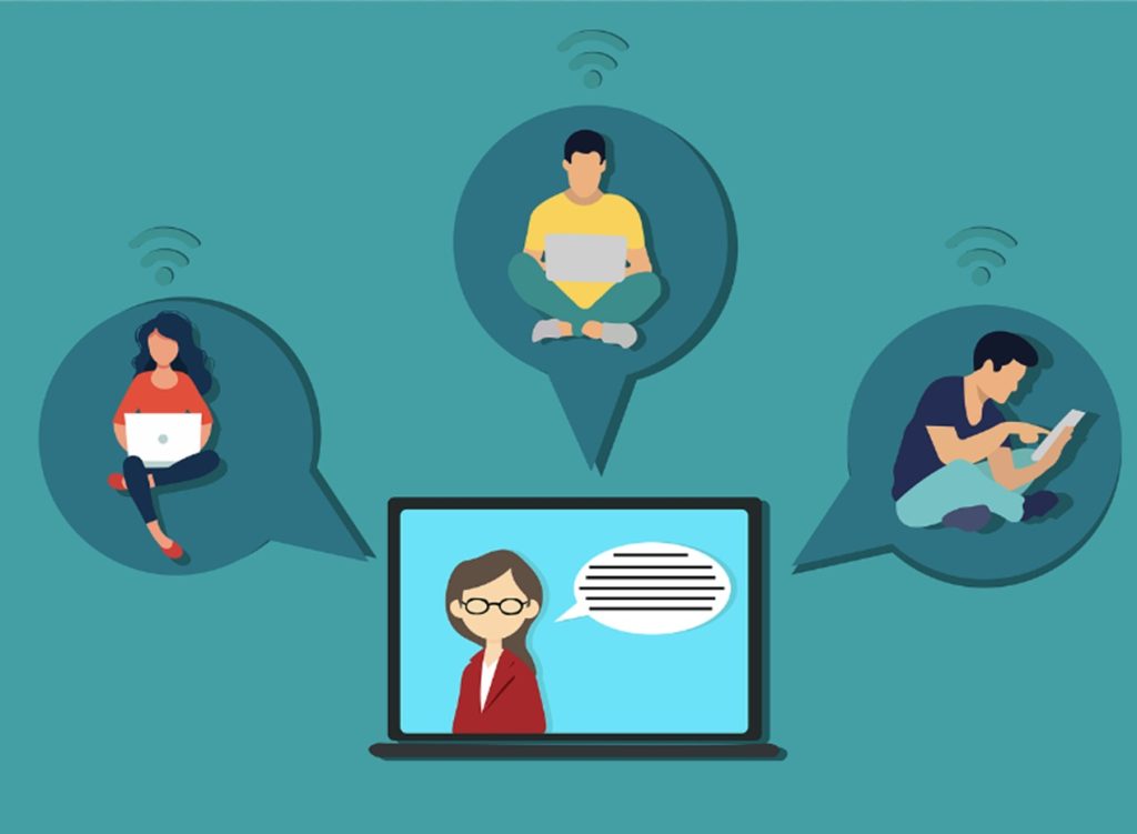 Folks participating in online training on computers.