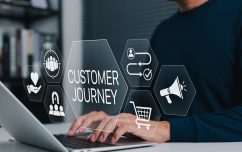 Person on laptop exploring "Customer Journey"