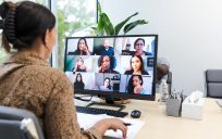 Woman at computer in online meeting.