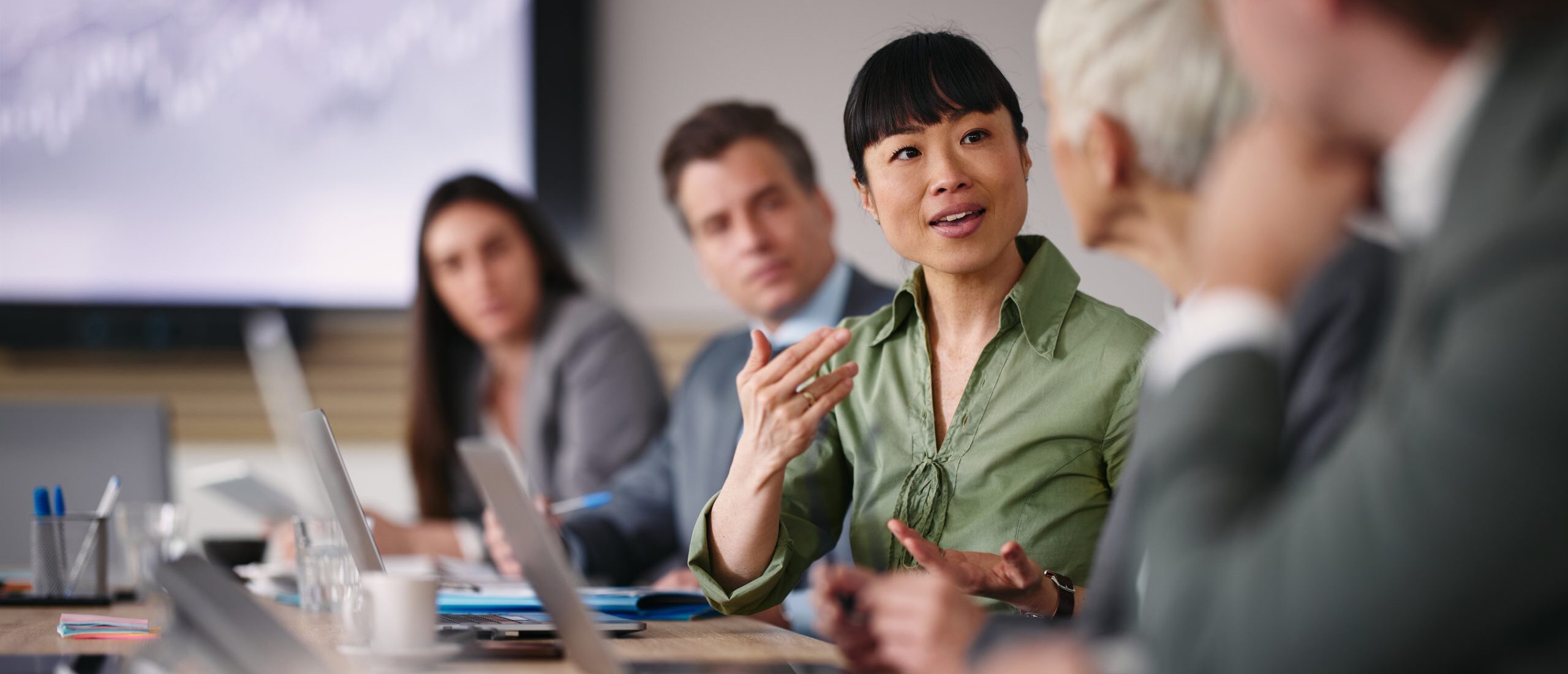 Woman leading meeting in office.